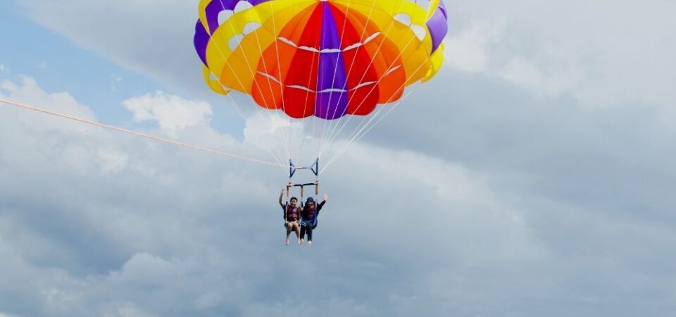 A photo of a couple parasailing over the sea in Kota Kinabalu, Sabah.