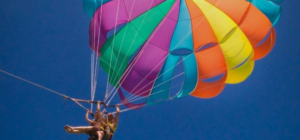 A photo of a couple doing parasailing over the sea in Kota Kinabalu, Sabah.