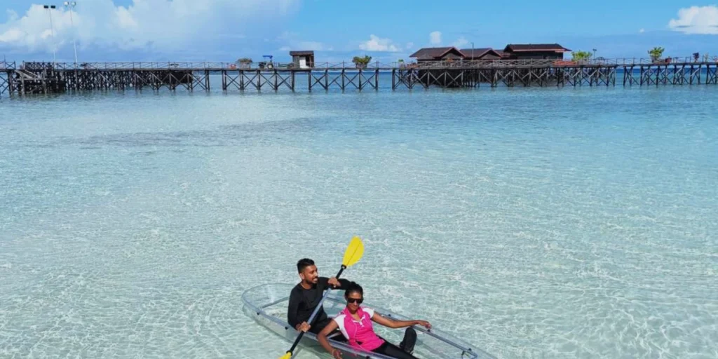Tourists Enjoying Kayaking in the Clear Turquoise Waters of Semporna