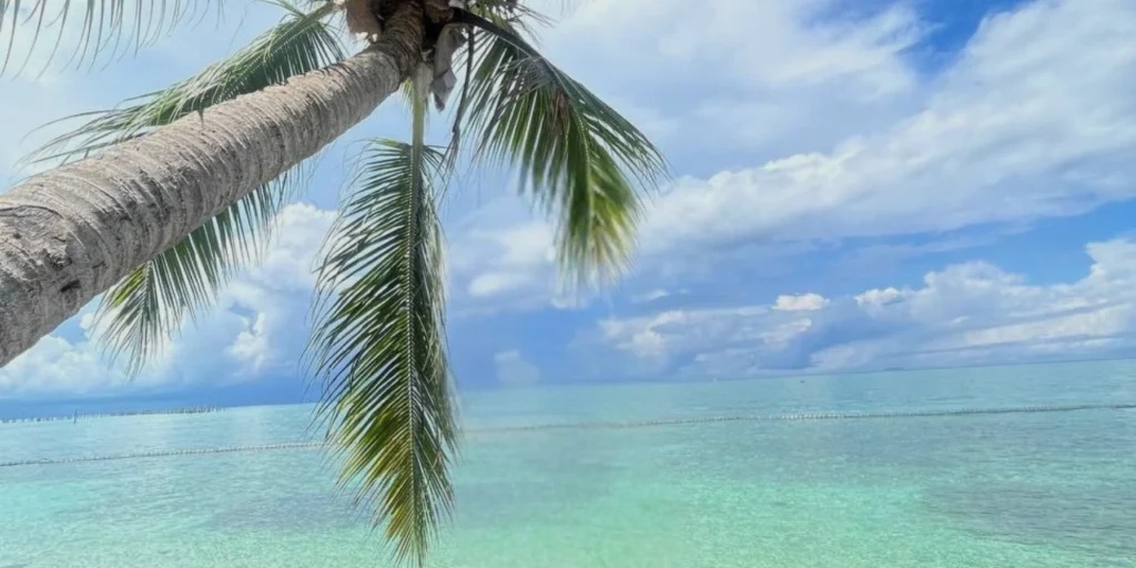Bright sunny day highlighting the crystal-clear turquoise waters of Kapalai Island