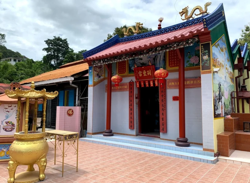 Goddess of Mercy Temple in Sandakan, part of the Sandakan Heritage Trail, featuring red lanterns, ornate carvings, and traditional Chinese architecture.