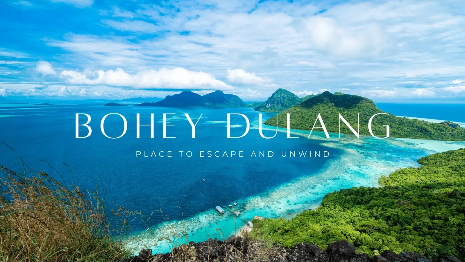 Semporna Island Hopping Guide 2026: Routes, Costs & Expert Tips 1 Semporna island hopping panoramic aerial view of Bohey Dulang lagoon and tropical islands in Sabah